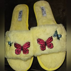 Rue21 yellow fuzzy slippers with butterflies. Size 8.